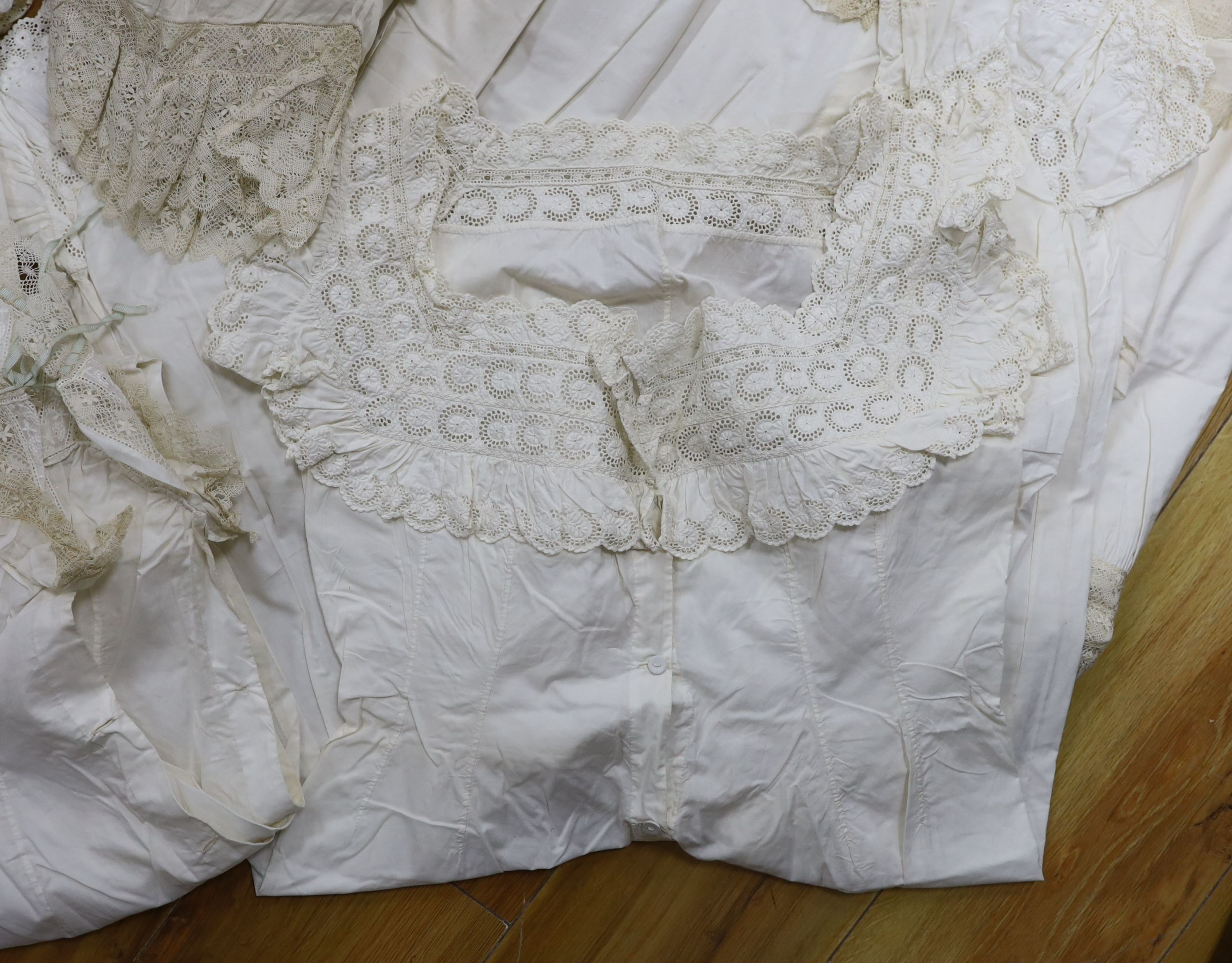 A collection of chemise/pantaloon lace inserted undergarments and a collection of petticoat flounces
